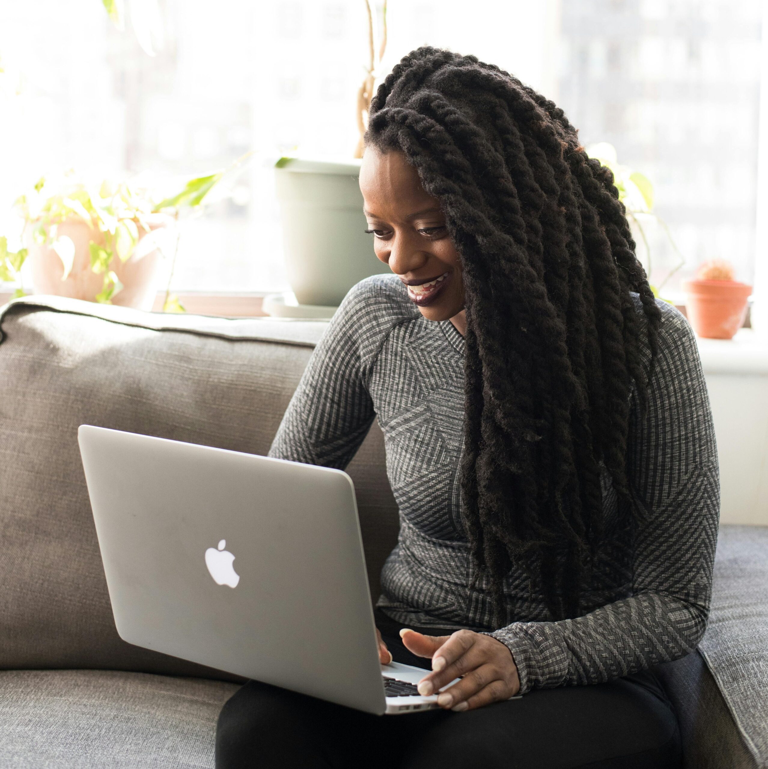 Woman using laptop symbolising self-managed strata assistance service in WA
